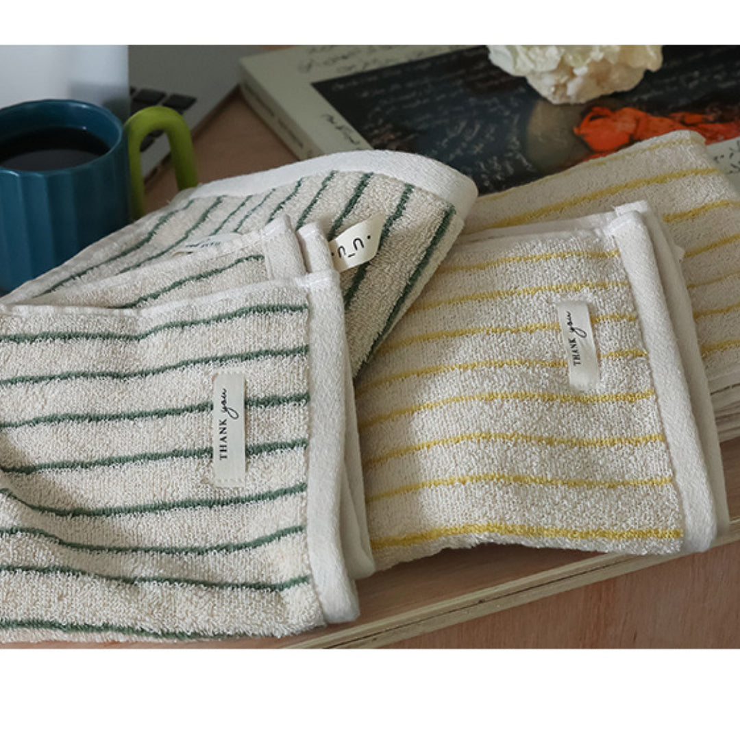 Fine stripe embroidered jacquard towel