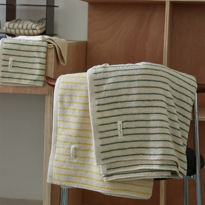 Fine stripe embroidered jacquard towel